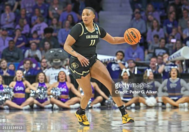 Quay Miller of the Colorado Buffaloes dribbles the ball up court against the Kansas State Wildcats in the second half during the second round of the...