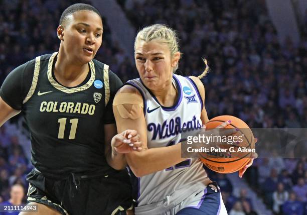 Gabby Gregory of the Kansas State Wildcats drives with the ball against Quay Miller of the Colorado Buffaloes in the first half during the second...