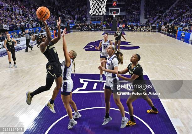 Jaylyn Sherrod of the Colorado Buffaloes shoots the ball against Gabby Gregory of the Kansas State Wildcats in the first half during the second round...