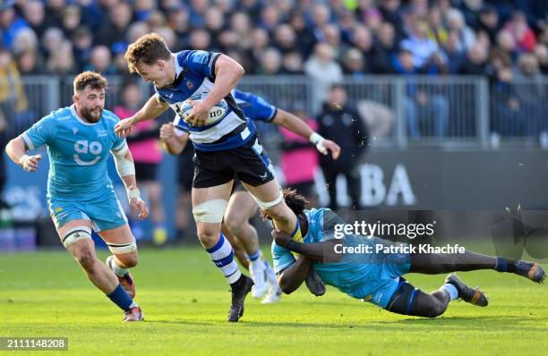 Ted Hill of Bath Rugby is tackled by Asher Opoku-Fordjour of Sale Sharks during the Gallagher Premiership Rugby match between Bath Rugby and Sale...