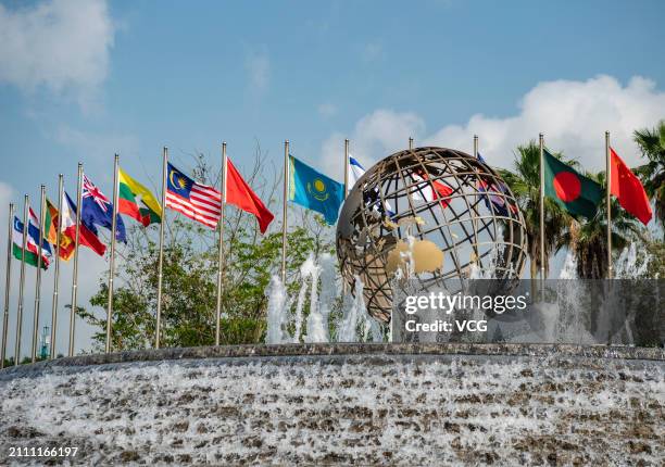 National flags flutter at the Boao Forum for Asia International Conference Center before Boao Forum For Asia Annual Conference 2024 on March 25, 2024...