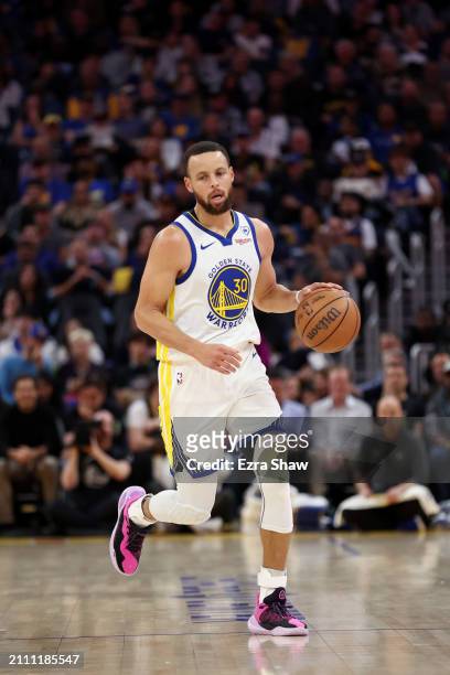 Stephen Curry of the Golden State Warriors dribbles the ball against the New York Knicks at Chase Center on March 18, 2024 in San Francisco,...
