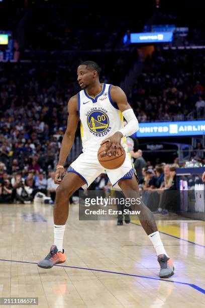 Jonathan Kuminga of the Golden State Warriors dribbles the ball against the New York Knicks at Chase Center on March 18, 2024 in San Francisco,...