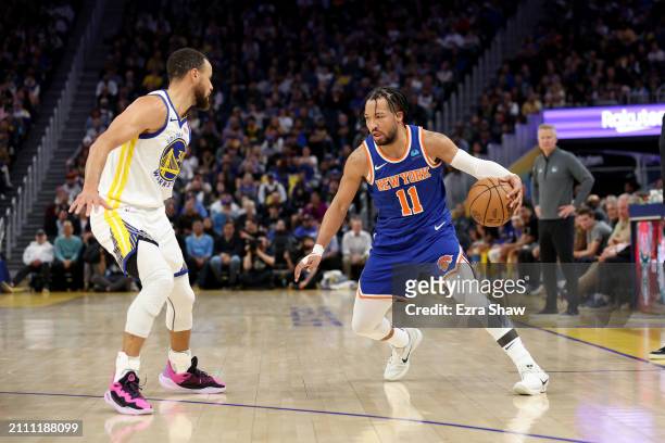 Jalen Brunson of the New York Knicks is guarded by Stephen Curry of the Golden State Warriors at Chase Center on March 18, 2024 in San Francisco,...