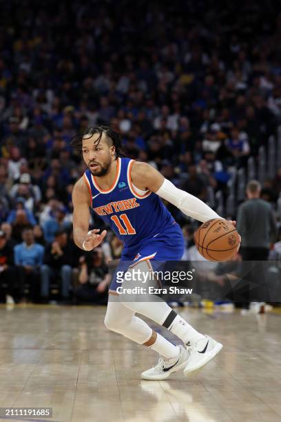 Jalen Brunson of the New York Knicks dribbles the ball against the Golden State Warriors at Chase Center on March 18, 2024 in San Francisco,...