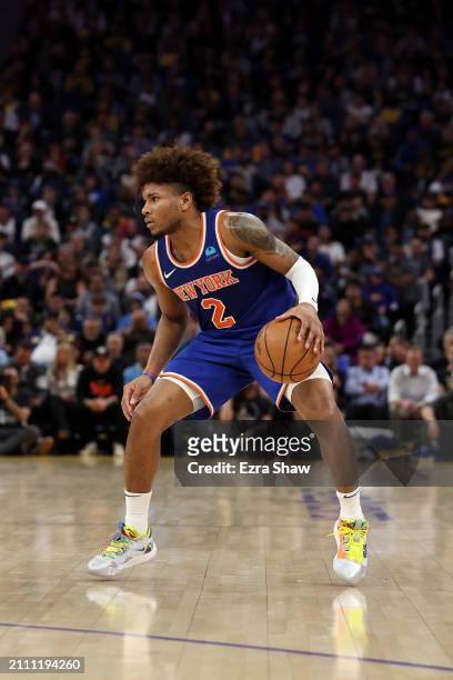 Miles McBride of the New York Knicks dribbles the ball against the Golden State Warriors at Chase Center on March 18, 2024 in San Francisco,...