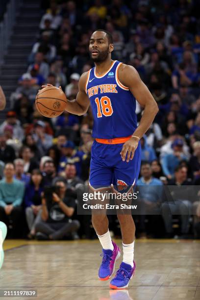 Alec Burks of the New York Knicks dribbles the ball against the Golden State Warriors at Chase Center on March 18, 2024 in San Francisco, California....