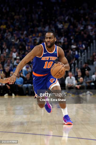 Alec Burks of the New York Knicks dribbles the ball against the Golden State Warriors at Chase Center on March 18, 2024 in San Francisco, California....