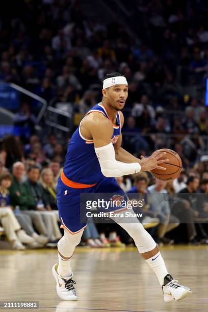 Josh Hart of the New York Knicks looks to pass the ball against the Golden State Warriors at Chase Center on March 18, 2024 in San Francisco,...