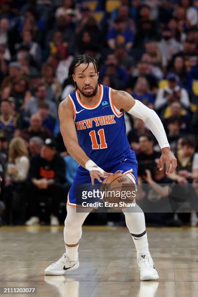 Jalen Brunson of the New York Knicks dribbles the ball against the Golden State Warriors at Chase Center on March 18, 2024 in San Francisco,...