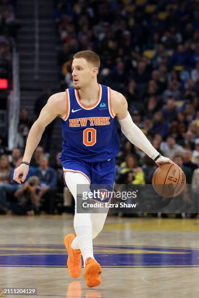 Donte DiVincenzo of the New York Knicks dribbles the ball against the Golden State Warriors at Chase Center on March 18, 2024 in San Francisco,...