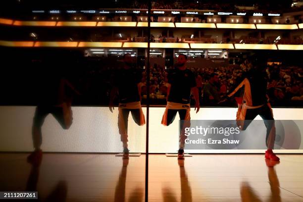 Stephen Curry and Draymond Green of the Golden State Warriors warm up before their game against the New York Knicks at Chase Center on March 18, 2024...