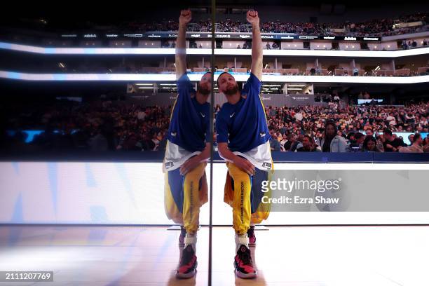 Stephen Curry of the Golden State Warriors warms up before their game against the New York Knicks at Chase Center on March 18, 2024 in San Francisco,...