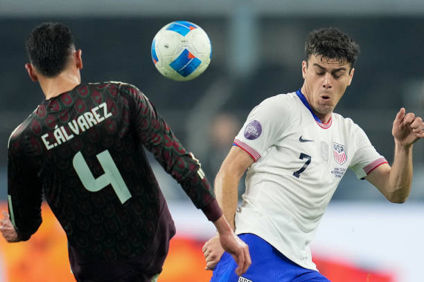 Gio Reyna of the United States battles with Edson Alvarez of Mexico during the CONCACAF Nations League Final between Mexico and USMNT at AT&T Stadium...