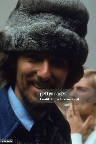 Headshot of American rock singer and songwriter John Phillips , of The Mamas and The Papas, wearing a fur hat at the Monterey Pop Music Festival,...