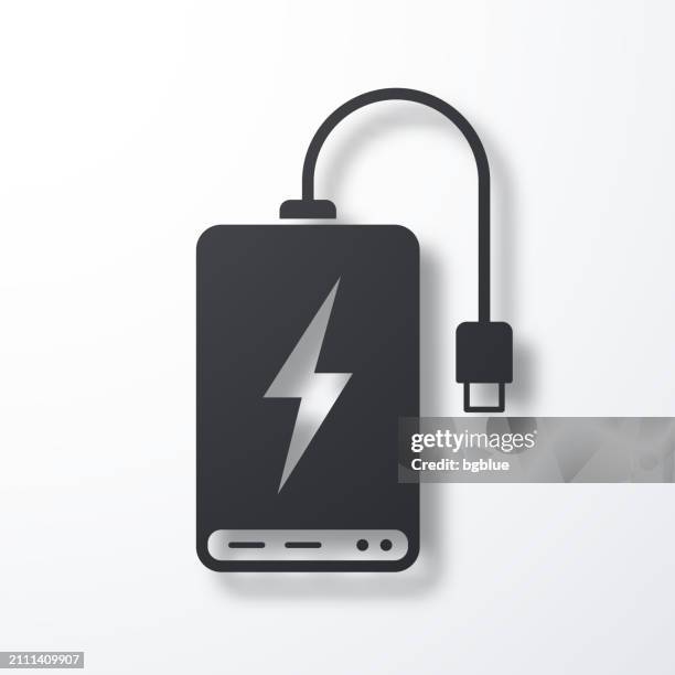power bank. icon with shadow on white background - usb cable stock illustrations