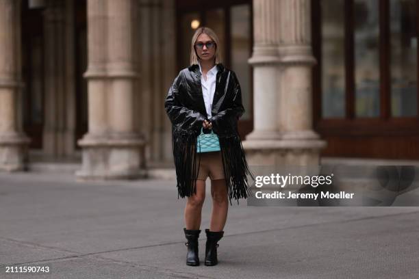 Karin Teigl seen wearing Jacques Marie Mage brown sunglasses with blue lenses, By Aylin Koenig white cotton buttoned shirt, Herskind black leather...