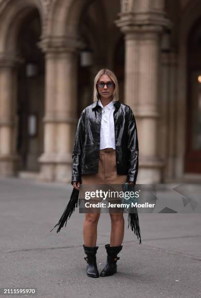 Karin Teigl seen wearing Jacques Marie Mage brown sunglasses with blue lenses, By Aylin Koenig white cotton buttoned shirt, Herskind black leather...