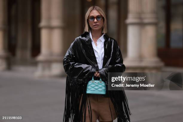 Karin Teigl seen wearing Jacques Marie Mage brown sunglasses with blue lenses, By Aylin Koenig white cotton buttoned shirt, Herskind black leather...