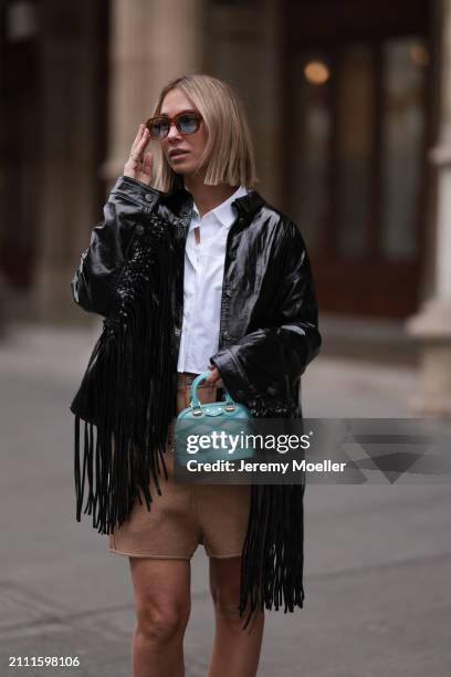 Karin Teigl seen wearing Jacques Marie Mage brown sunglasses with blue lenses, By Aylin Koenig white cotton buttoned shirt, Herskind black leather...