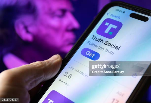 In this photo illustration a smartphone screen displays the logo of Donald Trump's Truth Social app March 25 2024 in Bath, England. Former US...