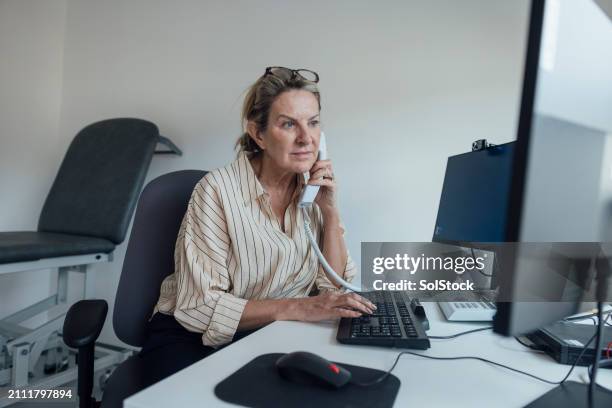 over the phone consultation - general practitioner stock pictures, royalty-free photos & images