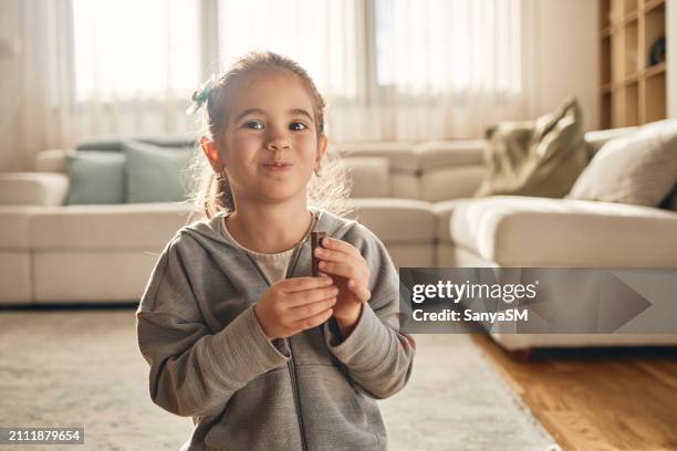 beautiful happy eating chocolate - chocolate lips stock pictures, royalty-free photos & images