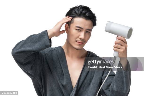 a young man in a bathing suit - drying hair stock pictures, royalty-free photos & images