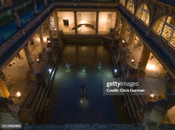 The Roman Baths in the City of Bath undergo a spring clean by torchlight on March 18,2024 in Bath, England. The spring clean of the Great Bath sees...