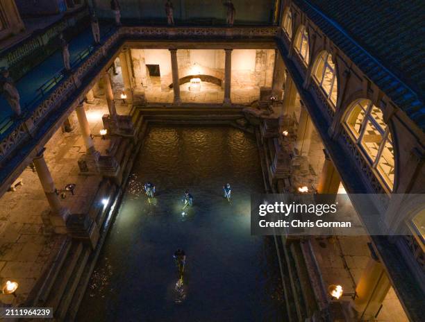 The Roman Baths in the City of Bath undergo a spring clean by torchlight on March 18,2024 in Bath, England. The spring clean of the Great Bath sees...