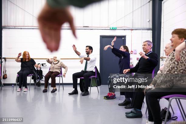 First Minister Humza Yousaf takes part in a dance performance during a visit to DN Studios on March 25, 2024 in Edinburgh, Scotland. The First...