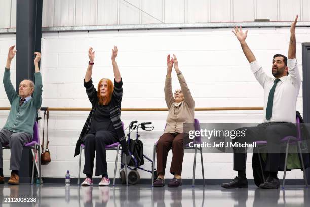 First Minister Humza Yousaf takes part in a dance performance during a visit to DN Studios on March 25, 2024 in Edinburgh, Scotland. The First...