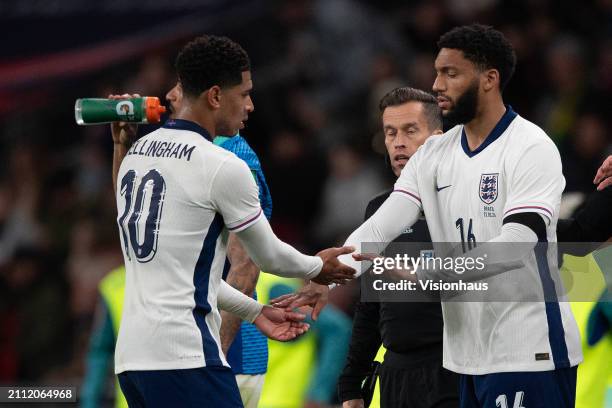 Jude Bellingham of England is substituted and is greeted by Joe Gomez during the international friendly match between England and Brazil at Wembley...