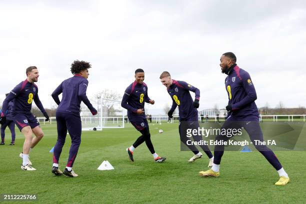 Players of England warm up during a training session at Tottenham Hotspur Training Centre on March 25, 2024 in Enfield, England.