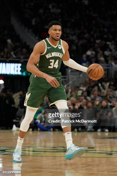 Giannis Antetokounmpo of the Milwaukee Bucks dribbles the ball during the second half against the Oklahoma City Thunder at Fiserv Forum on March 24,...
