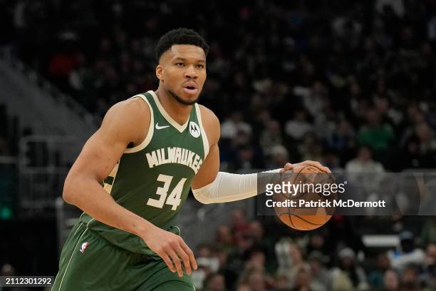 Giannis Antetokounmpo of the Milwaukee Bucks dribbles the ball during the second half against the Oklahoma City Thunder at Fiserv Forum on March 24,...