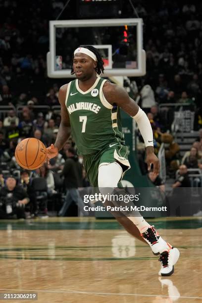 Chris Livingston of the Milwaukee Bucks dribbles the ball during the second half against the Oklahoma City Thunder at Fiserv Forum on March 24, 2024...