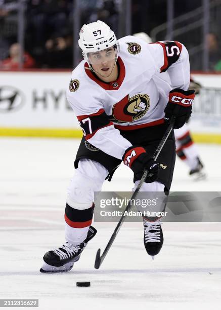 Shane Pinto of the Ottawa Senators in action against the New Jersey Devils during the third period at the Prudential Center on March 23, 2024 in...