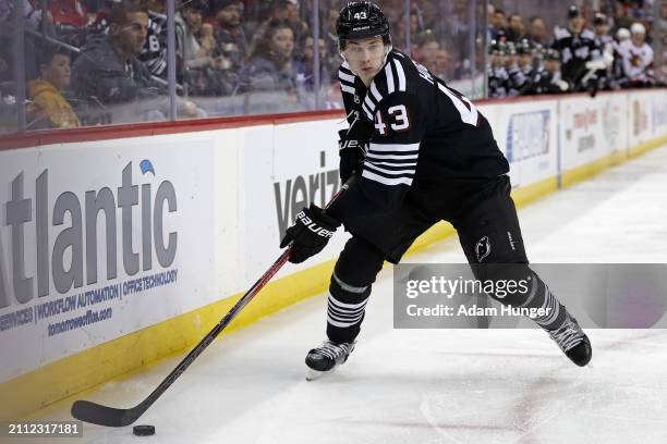 Luke Hughes of the New Jersey Devils in action against the Ottawa Senators during the second period at the Prudential Center on March 23, 2024 in...