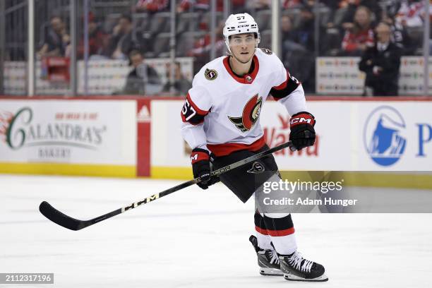 Shane Pinto of the Ottawa Senators in action against the New Jersey Devils during the third period at the Prudential Center on March 23, 2024 in...