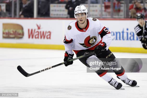 Shane Pinto of the Ottawa Senators in action against the New Jersey Devils during the third period at the Prudential Center on March 23, 2024 in...