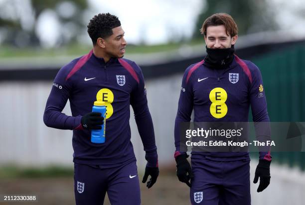 Ben Chilwell and Jude Bellingham of England walk to a training session at Tottenham Hotspur Training Centre on March 25, 2024 in Enfield, England.