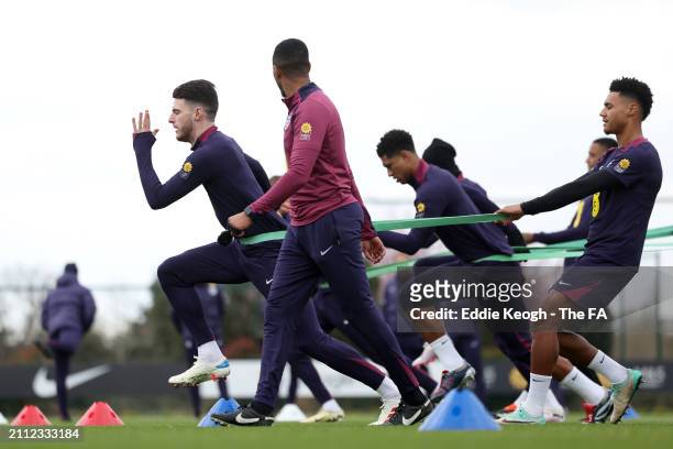 Declan Rice and Ollie Watkins of England in action during a training session at Tottenham Hotspur Training Centre on March 25, 2024 in Enfield,...