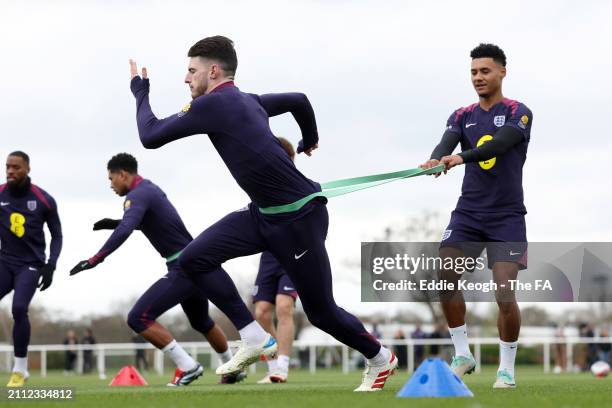 Declan Rice and Ollie Watkins of England in action during a training session at Tottenham Hotspur Training Centre on March 25, 2024 in Enfield,...