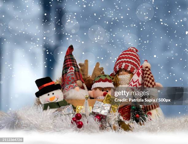 close-up of christmas decorations on fake snow - christmas background vector stock pictures, royalty-free photos & images