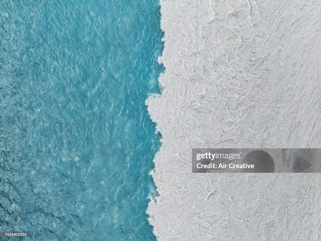 Drone image looking down on a confluence, an abrupt meeting of two rivers each having independent flow and sediment discharge regimes