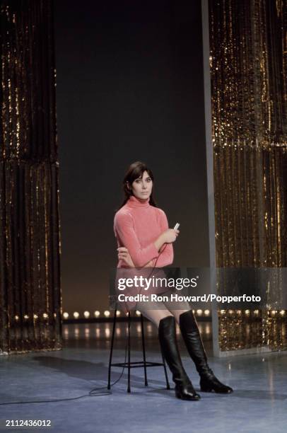 English singer and actress Anita Harris performs on the set of a pop music television show in London circa 1967.