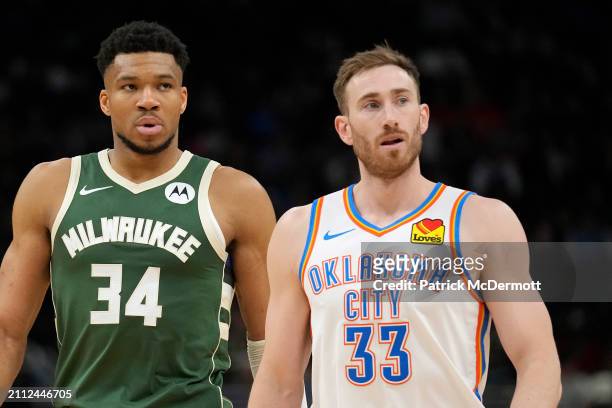 Giannis Antetokounmpo of the Milwaukee Bucks and Gordon Hayward of the Oklahoma City Thunder in action during the second half at Fiserv Forum on...