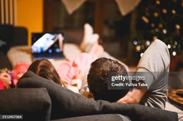 family using digital tablet at bed. - film screening room stock pictures, royalty-free photos & images