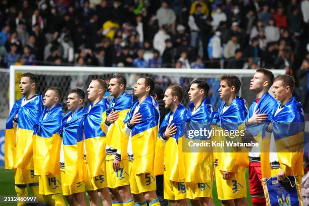 The Ukraine team stand in a line up of ahead of the U-23 international friendly match between Japan and Ukraine at Mikuni World Stadium Kitakyushu on...